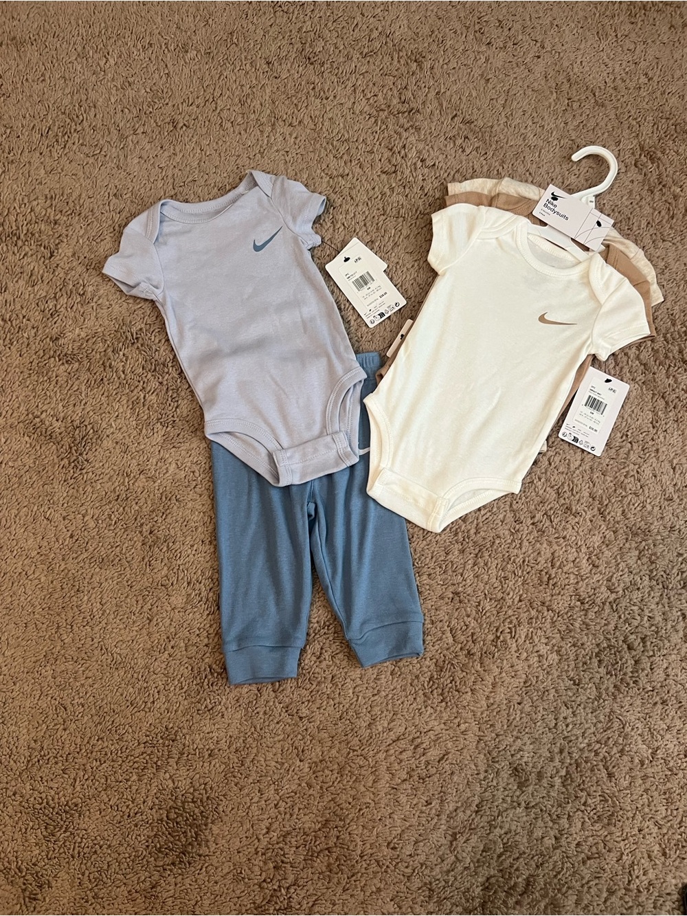 Nike Baby 3 Pack One-Piece Bodysuits & Light Blue Pants & onesie